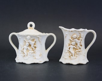 Vintage Small Bisque Cream & Sugar Set with Carved Cherubs (E6920)