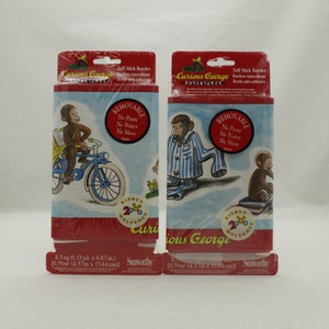 May include: Two rolls of Curious George self-stick border. The border features illustrations of Curious George in various scenes, including riding a bicycle and wearing pajamas. Each roll is 8.5 sq. ft. (5 yd. x 6.87 in.). The packaging includes the text "Removable, No Paste, No Water, No Mess."