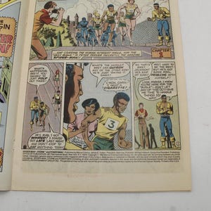 May include: Comic book page featuring panels from "Spider-Man" and "Power Man." The panels depict action scenes with characters in colorful costumes, including Spider-Man and Power Man. Text bubbles and captions add to the narrative.