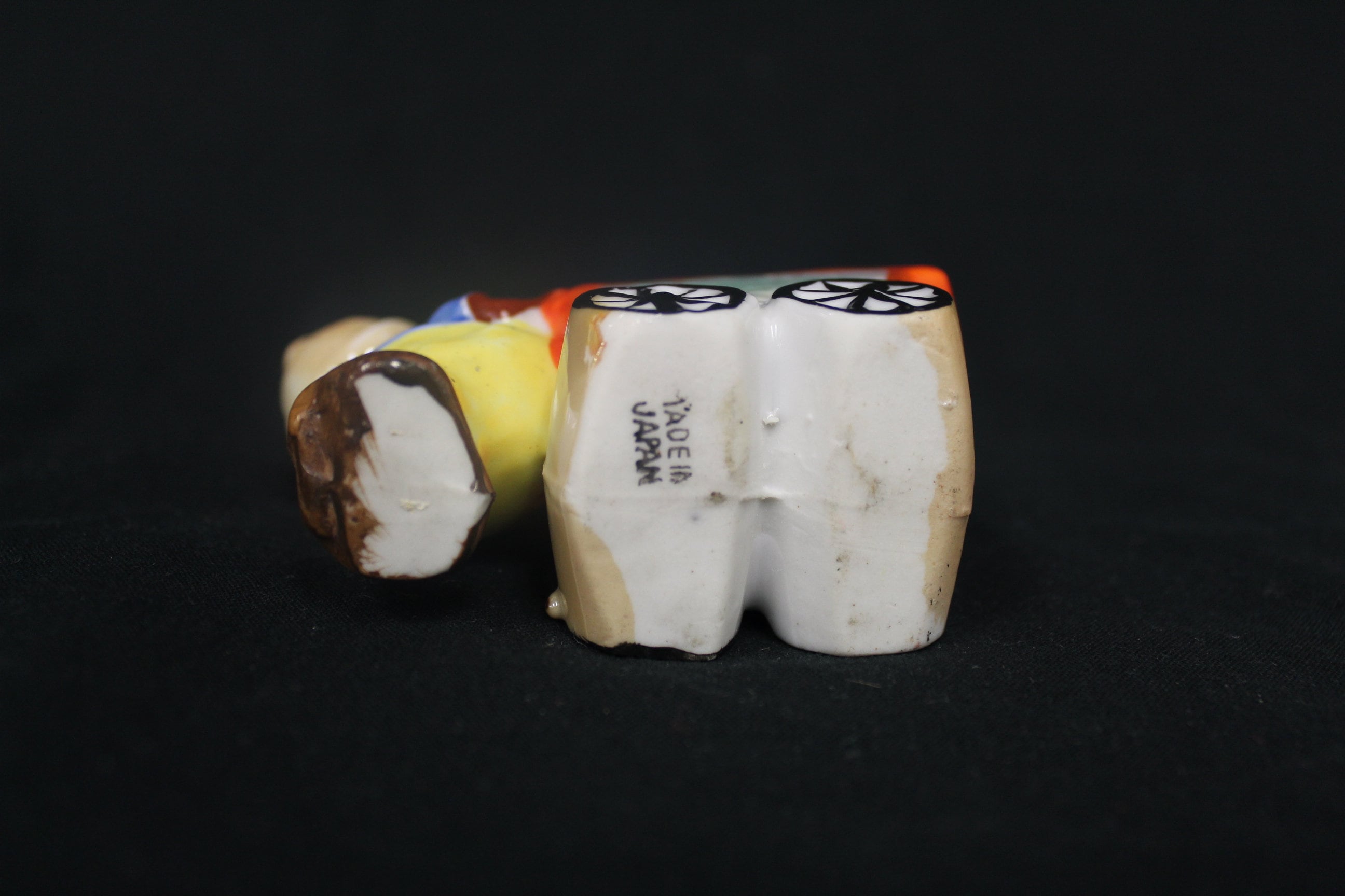 Vintage Smiling Dwarf Miner Man Japan Ceramic Boy Pushing Orange