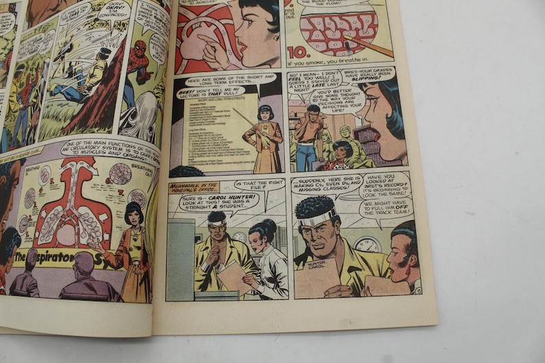 May include: A vintage comic book page with colorful illustrations. Panels depict scenes with characters, speech bubbles, and text. One panel shows a diagram of the respiratory system. The comic book is open, revealing multiple panels and text.