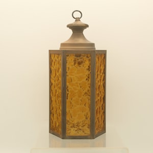 May include: A hexagonal amber glass pendant light fixture with a brass top and chain.