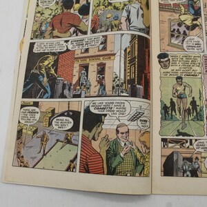May include: A vintage comic book page with multiple panels. The panels depict scenes with people in various settings, including a social club and outdoor scenes. Text bubbles contain dialogue. The comic book is yellowed with age.