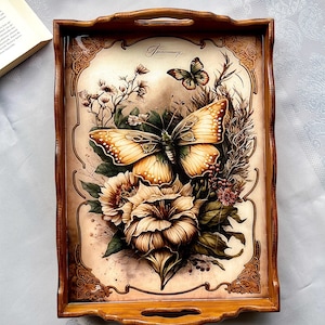 May include: A rectangular wooden serving tray with a decorative butterfly and floral design. The tray has a brown border and handles. The artwork features butterflies, flowers, and the word "Anniversary".
