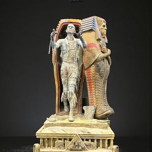 May include: A detailed figurine of a mummy emerging from a sarcophagus, with a pharaoh figure standing behind. The base features hieroglyphs and the text "THE MUMMY". The color palette includes beige, gold, and red.