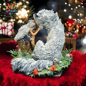 May include: A detailed figurine showing a wolf-like creature and a figure in a feathered cloak. The figurine is set on a base with mushrooms and foliage. The text "X-Art Studio in fun we trust" is visible.