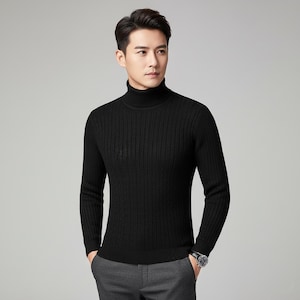 May include: A black turtleneck sweater with a ribbed texture. The long-sleeved sweater is made of a soft material and is suitable for cooler weather. The model is wearing gray pants and a watch.