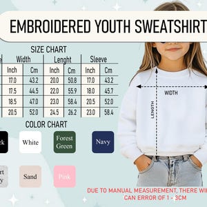 May include: A white embroidered youth sweatshirt is displayed with a size chart and colour chart. The size chart includes measurements in inches and centimetres. The colour chart shows black, white, forest green, navy, sport grey, sand, and pink.