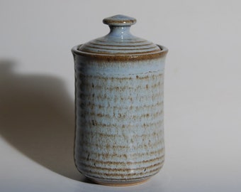 Lidded jar with blue and brown glaze