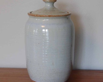 Tall lidded jar with light blue gray glaze