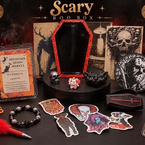 May include: A Scary Boo Box collection featuring a coffin-shaped tray, wax melts labeled Midnight Moon Market, a beaded pen with red fur, a black beaded bracelet, various horror-themed stickers, a small skull, a cat figurine, and a knife cutout.