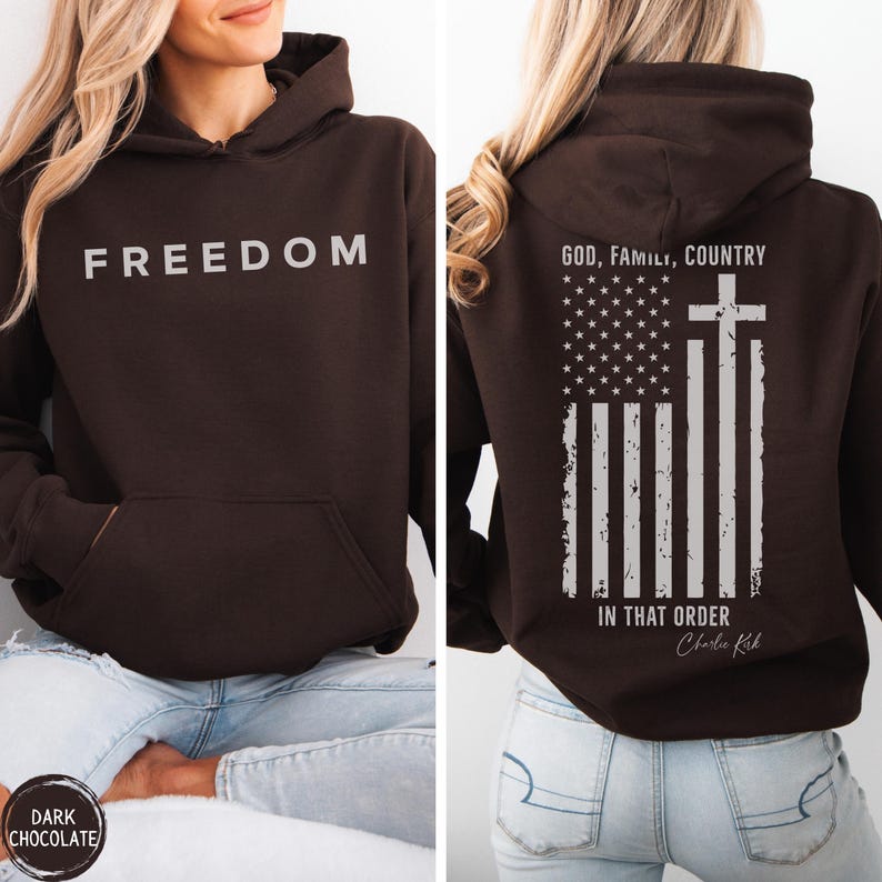May include: Dark chocolate brown hoodie with the word "FREEDOM" printed in white on the front. The back features an American flag design with a cross and the text "GOD, FAMILY, COUNTRY IN THAT ORDER".