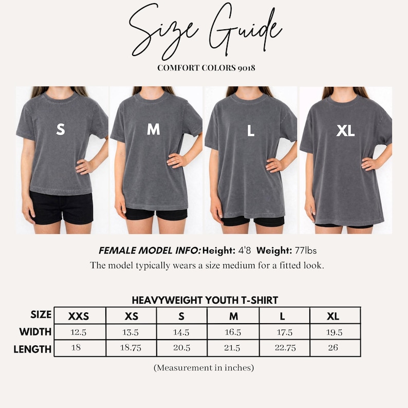 May include: A size guide for Comfort Colors 9018 heavyweight youth t-shirts. The image displays four charcoal grey t-shirts labelled S, M, L, and XL. A table provides width and length measurements in inches for sizes XXS through XL, alongside model info.