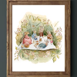 May include: A framed watercolour illustration depicting a group of anthropomorphic mice having a picnic on a white blanket. The scene features mice in various clothing, surrounded by green foliage and pink flowers, with food items like bread and fruit.