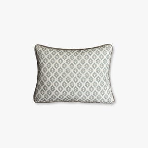 May include: A rectangular cushion featuring a geometric design in grey and white. The cushion has a grey border and is suitable for home decoration.