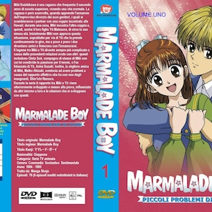 Può includere: DVD della serie anime "Marmalade Boy", Volume 1. La copertina presenta due personaggi animati, una ragazza con i capelli castani e un ragazzo con i capelli biondi, che si abbracciano. Il testo include "Marmalade Boy" e "Piccoli Problemi di Cuore."