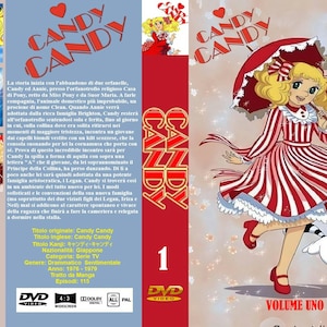 Può includere: Cofanetto DVD di "Candy Candy" Volume Uno. La copertina presenta una ragazza dei cartoni animati con un vestito a righe rosse e bianche, che tiene un ombrellone, con un procione. La scatola ha testo giapponese e il logo DVD.
