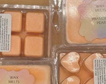 Cialde di cera di soia al gusto di pera al brandy / Torta a conchiglia all'arancia (6 cubetti)