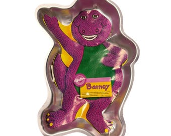 Wilton Barney, fioletowa forma do ciasta z dinozaurem, 1993, wycofana z użytku, NOS