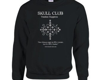 May include: Black sweatshirt with white text that reads "SKULL CLUB Voodoo Happens." Below the text is a white graphic and the quote, "New Orleans might be 90% Catholic, but it's 100% Voodoo." The website www.skull-club.com is also printed on the sweatshirt.