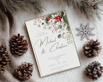May include: A wedding invitation with a gold border, featuring the names "Michael & Christine" in elegant script. The invitation is decorated with floral elements, including red berries and green leaves. Pine cones and a silver snowflake add to the festive theme.