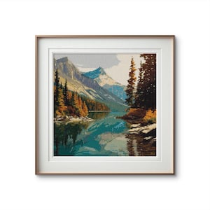 Può includere: Opera d'arte a punto croce incorniciata, raffigurante un paesaggio con un lago sereno che riflette montagne innevate e alberi autunnali colorati. L'opera è incorniciata in una cornice dorata e con un passe-partout bianco, creando una presentazione classica ed elegante.