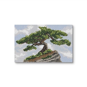 May include: Cross-stitch artwork of a bonsai tree on a rocky outcrop. The tree has green foliage and a curved trunk. The background features a blue sky with white clouds. The artwork is displayed on a canvas.