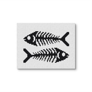 May include: A square, white canvas featuring a cross-stitch design of two black fish skeletons. The fish are positioned one above the other, with detailed rib structures and tail fins. The background is a grid pattern.