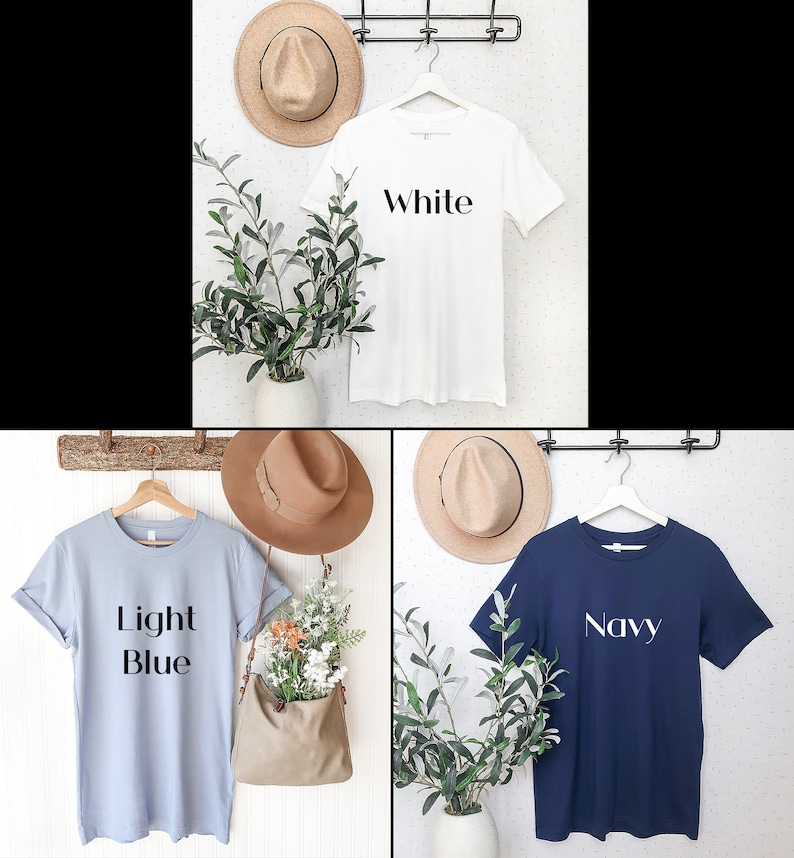以下が含まれることがあります： 白いTシャツ、薄い青色のTシャツ、紺色のTシャツの3枚がハンガーにかけられています。それぞれのTシャツには、前面に異なる色の単語が印刷されています。「白」、「薄い青」、「紺」です。