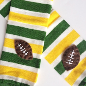 Snack Size Leg Candy Football Baby Leg Warmers: green, yellow, white stripes with footballs image 1