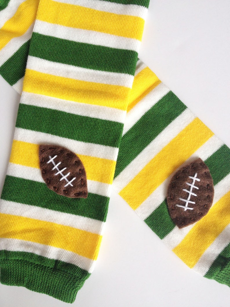 Snack Size Leg Candy Football Baby Leg Warmers: green, yellow, white stripes with footballs image 1