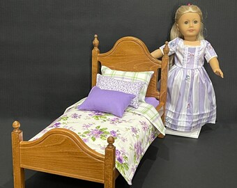 Doll furniture, 18-in stained bed with lilac, white and green bedding. Shipping is included in the price.