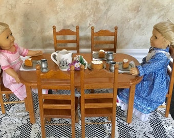 Stained Doll Table with six chairs for an 18-inch doll. Shipping is included in the price.