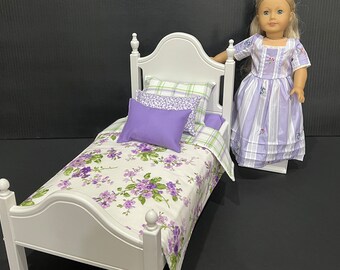 Doll furniture, 18-in stained bed with lilac, white and green bedding. Shipping is included in the price.