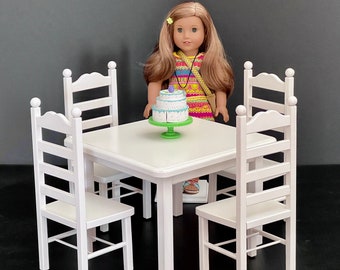 White, square doll table and four chairs for 18-inch dolls. Shipping is included in the price.