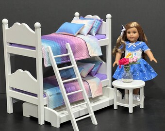 Doll bunk bed for 18-inch dolls with cream, pink, purple, and blue bedding. Shipping is included in the price.