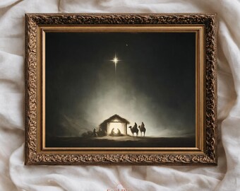 May include: A framed artwork depicting the Nativity scene. The image shows a star shining over a stable, with figures inside and three men on camels approaching. The frame is ornate with a gold finish. The artwork is signed "Soul Rise Art & Design".