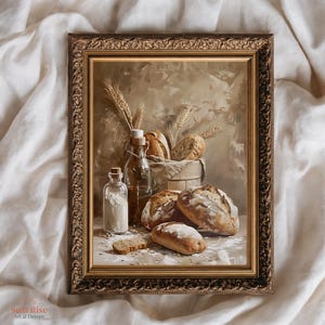 May include: A framed still life painting featuring various types of bread, a bottle of flour, and wheat stalks. The painting has a warm color palette with shades of brown and beige. The frame is ornate and gold-colored.