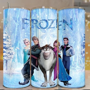 May include: A set of three stainless steel tumblers featuring characters from the animated film "Frozen." The tumblers have a blue and white winter scene background with the word "FROZEN" in large blue letters.