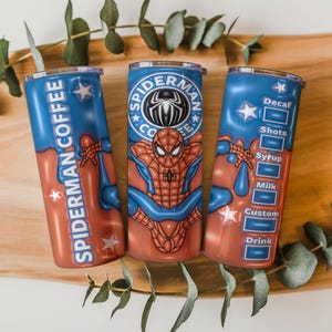 May include: Three stainless steel tumblers with a Spider-Man theme. The tumblers are red and blue with the words "Spider-Man Coffee" and a Spider-Man graphic. One tumbler has a coffee customization menu.