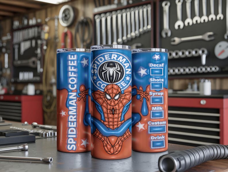 May include: Three stainless steel tumblers with a Spider-Man theme. The tumblers feature a blue and orange color scheme with the words "Spider-Man Coffee" and a Spider-Man graphic. One tumbler has a coffee customization menu.