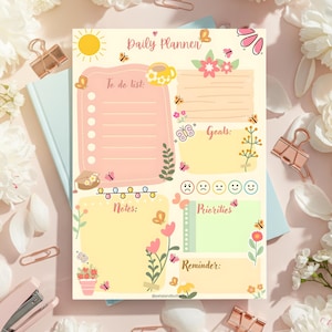 May include: A Daily Planner with a pastel color scheme, featuring sections for to-do lists, notes, goals, priorities, and reminders. The design includes floral and butterfly illustrations, with the text "Daily Planner" at the top.