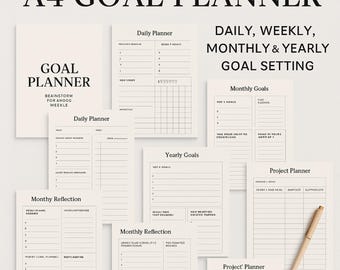 May include: A4 Goal Planner with various pages for daily, weekly, monthly, and yearly goal setting. Includes a cover page with "Goal Planner" and "Brainstorm for Ahogg Weekle" text. Features pages for daily, monthly, and yearly goals, and a project planner. A pen rests on the planner.
