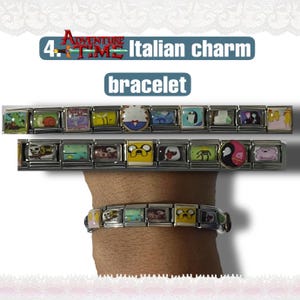 May include: Adventure Time Italian charm bracelets. The bracelets feature colorful, rectangular charms with various cartoon character designs. The image shows two separate bracelets and one worn on a wrist.