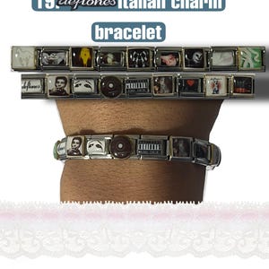 May include: A Deftones Italian charm bracelet with multiple rectangular charms. The charms feature images and text, including the band's name and album art. The bracelet is shown on a wrist.