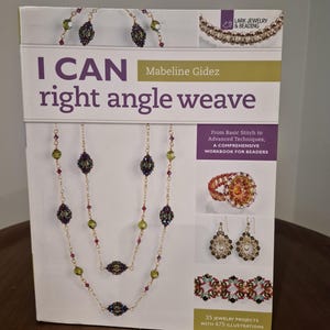 May include: A book titled "I Can Right Angle Weave" by Mabeline Gidez. The cover features beaded jewelry designs, including necklaces, earrings, and a ring. The book is a comprehensive workbook for beaders, with 25 jewelry projects and 475 illustrations.