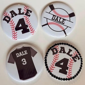 May include: Four white baseball-themed buttons with the name "DALE" and the number "4" or "3". One button features a baseball jersey design. The buttons have red and black accents.