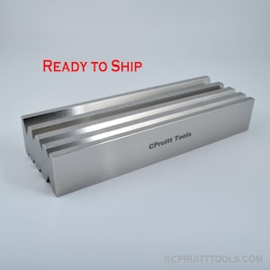 May include: A silver metal shaping tool with a series of grooves and the text "C Pruitt Tools" engraved on the side.  READY TO SHIP.