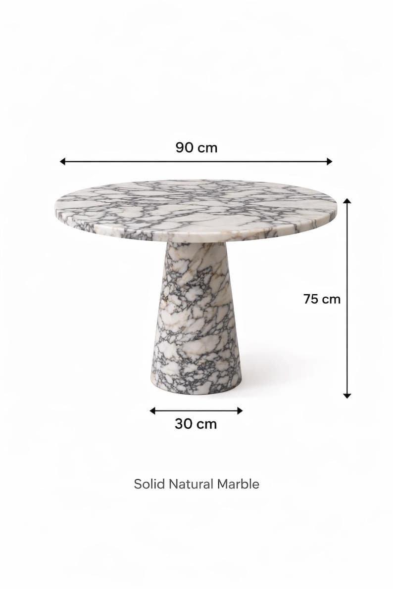 May include: A round marble table with a white and gray pattern. The tabletop is 35 inches in diameter and the table is 29.5 inches tall. The base is 12 inches wide. The text "Solid Natural Marble" is at the bottom.