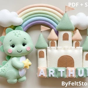 May include: A felt craft featuring a light green dinosaur holding a yellow star, a white castle with green and peach accents, a rainbow, and clouds. The name "ARTHUR" is spelled out in pastel blocks. The text "PDF + SVG" and "ByFeltStore" are also visible.